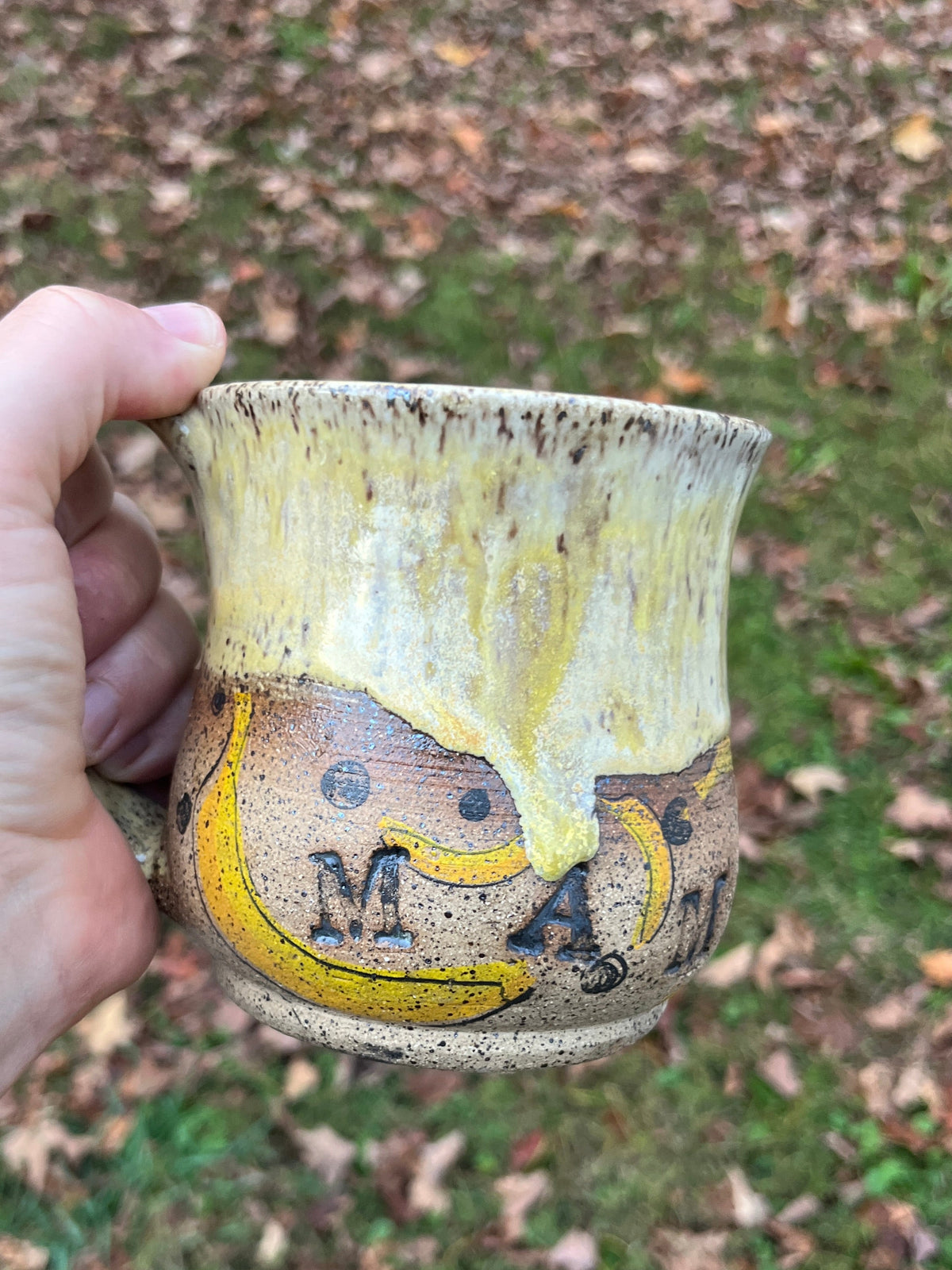 Yellow mug with bananas and m-a-m-d-a-n-i